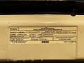 A 2017 Ford Econoline vehicle emission control information label with details about regulations and specifications