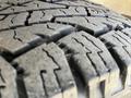 Close-up of a worn tire tread from a 2010 Mercedes-Benz Sprinter showing deep grooves and patterns for traction