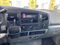 Interior dashboard of a 2007 Ford F-350 SD featuring a stereo system climate controls and a cup holder