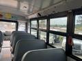 Interior view of a 2007 Freightliner B2 school bus showing empty seats and large windows along the side