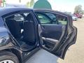 A 2019 Dodge Charger with its rear door open showcasing the interior and seating arrangement