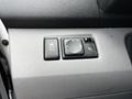 Control panel of a 2020 Nissan NV200 featuring a toggle switch labeled OFF and a multi-directional control knob