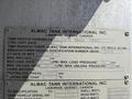 A metal identification plate from a 2009 International 7500 truck displaying specifications such as vehicle assembly, manufacturer design ID, and load capacity information