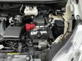 2020 Nissan NV200 engine compartment showing the battery air intake and various engine components