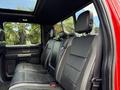 Interior view of the back seat of a 2019 Ford F-150 featuring black leather upholstery with a spacious design and headrests