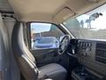Interior view of a 2012 GMC Savana with a single driver's seat and dashboard featuring controls and a display