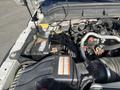 Close-up of the engine compartment of a 2015 Ford F-450 SD showing the battery connections and various engine components