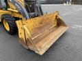 2011 John Deere 310SJ 4x4 Wheel Loader with an extended hoe and a 4 in 1 bucket in the foreground