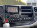 Interior dashboard of a 2020 Hino 155 featuring a touchscreen display climate control knobs and multiple control buttons