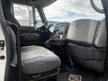 Interior view of a 2008 International 7500 truck showing the driver's seat dashboard and controls