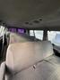 Interior view of a 2002 Ford Econoline showing gray cloth seats with a simple design and ample space in the cabin