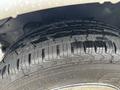 Close-up of a wet tire on a 2020 Chevrolet Express showcasing tread pattern and water droplets on the surface