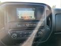 Interior dashboard of a 2018 GMC Sierra 1500 featuring a touchscreen display and various control buttons for climate and audio settings