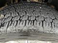 Close-up of a 2016 Ford F-150 tire showing detailed tread pattern and surface texture highlighting its wear and traction features