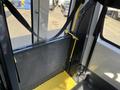 Interior view of a 2017 Chevrolet Express featuring a wheelchair lift with a yellow platform and safety straps