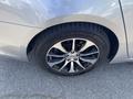 Close-up of a silver 2017 Acura TLX wheel featuring a multi-spoke alloy rim and a Michelin tire with visible tread patterns