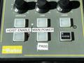 Control panel with buttons labeled Granular Lane Liquid Hoist Enable Main Power Pass and Reverse