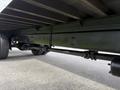 A 2017 Hino 338 truck is shown from underneath highlighting its axles and wheel assembly with visible tires and a sturdy chassis