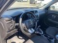 Interior view of a 2017 Kia Soul showing the steering wheel gear shift and dashboard with controls and an infotainment screen