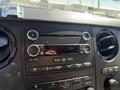 Dashboard of a 2014 Ford F-250 SD featuring a car stereo system with buttons for CD and radio controls and air conditioning vents