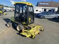 2010 Kubota F3680 with a yellow mowing deck attached featuring a cab design and four wheels visible in the foreground