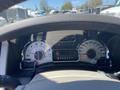 Dashboard of a 2013 Ford Expedition displaying speedometer fuel gauge and various warning lights