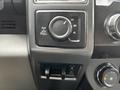 Close-up of control knobs in the interior of a 2020 Ford F-350 SD showing settings for 2H 4H and 4L along with other buttons and dials