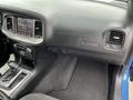 Interior view of a 2022 Dodge Charger highlighting the dashboard controls and air conditioning vents with the Charger emblem visible
