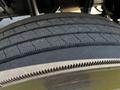Close-up of a treaded tire from a 2004 Freightliner M2 showing detailed patterns and grooves for traction