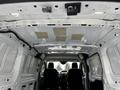 Interior of a 2018 Ford Transit van showing the ceiling and front seats with a white metal structure and no visible upholstery or cargo