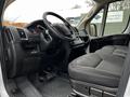 Interior of a 2018 RAM Promaster showing the driver's seat dashboard and steering wheel with a cloth upholstery and various controls