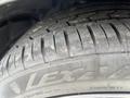 A close-up view of a tire on a 2017 Dodge Challenger showcasing the tread pattern and sidewall details