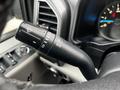 Close-up of a 2017 Ford F-150’s multifunction lever showing controls for headlights and turn signals
