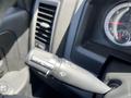 A black windshield wiper control lever with various settings including mist and off, located inside a 2019 RAM 1500 Classic vehicle cabin