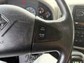 Close-up of the steering wheel of a 2016 International 7400 showing cruise control buttons labeled set resume and accel