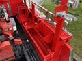 A red utility bed with various tool holders and attachments visible on the side of a 2001 Toyota Dyna