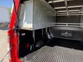 A 2018 GMC Canyon with a truck bed featuring a metal storage compartment and a black textured liner