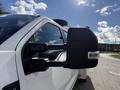 A close-up of the side mirror of a 2024 Ford F-550 showcasing its design and features