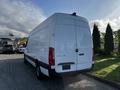 A 2022 Mercedes-Benz Sprinter van in white with a high roof and rear doors visible from the back