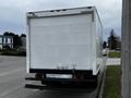 A 2013 Hino 195 box truck viewed from the rear with a white exterior and a flat loading platform at the back