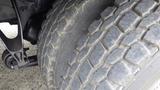 Close-up of a worn tire on a 2012 International 7400 showing tread patterns and surface wear