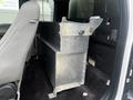 A 2017 Ford F-150 with a metal storage box installed in the rear cabin area beside the driver's seat