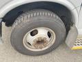 A close-up view of a tire on a 2016 Chevrolet Express showcasing the wheel rim and tread pattern