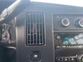 Dashboard of a 2017 Chevrolet Express featuring air vents controls and radio display with various knobs and buttons