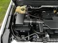 Engine compartment of a 2018 Chevrolet Colorado featuring the air intake system and coolant reservoir