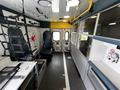 Interior of a 2013 Chevrolet Express with seating for emergency personnel and equipment storage areas