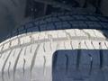 Close-up of a worn tire tread from a 2013 Ford Expedition showing detailed grooves and patterns on the rubber surface