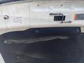 Close-up of a 2017 Ford F-150's interior panel showing the vehicle identification number label and some mounting hardware