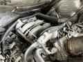Close-up view of the engine components of a 2009 Morgan Olson Workhorse with various hoses and connectors visible