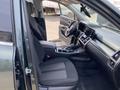 Interior of a 2022 Kia Sorento featuring two front seats a dashboard with a touchscreen display and a center console